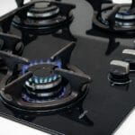 A lit gas cooktop